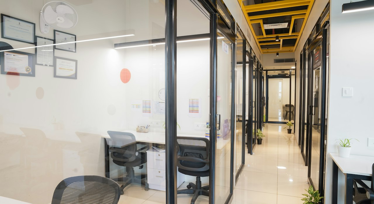 Modern office interior with glass-walled rooms