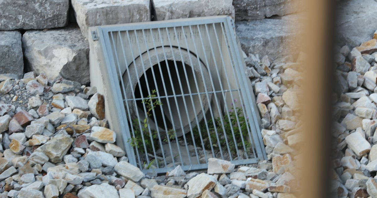 Stormwater outfall with a metal grate